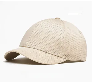 Detailed view of the breathable beige mesh fabric and ventilation holes of the baseball cap