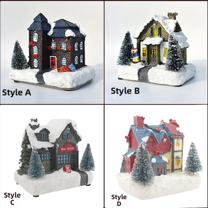 Detail of four miniature Christmas snow house designs with resin textures and festive trees