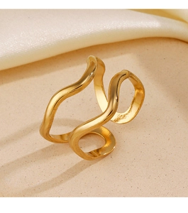 Macro detail of wave-shaped golden ring with polished texture and minimalist design