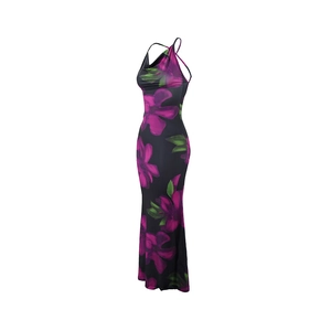 Detail of floral printed maxi dress with criss-cross back straps on a slim fit silhouette
