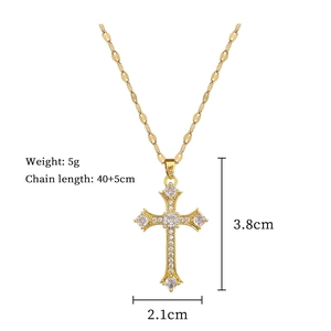 Detailed view of gold cross necklace with zircon stones and size specifications