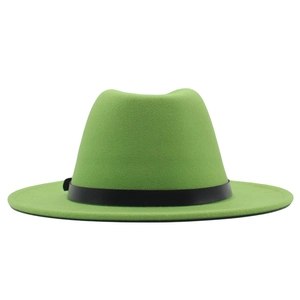 Detail of bright green wool fedora hat featuring a stylish black leather belt band