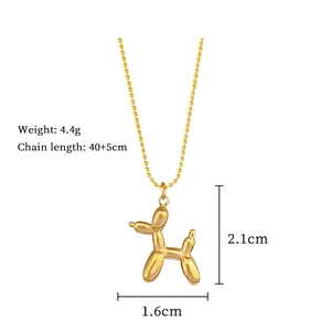 Detail shot of golden balloon dog pendant necklace with chain size and weight dimensions