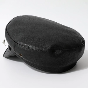 Punk style leather newsboy cap with silver rivet detail and textured finish