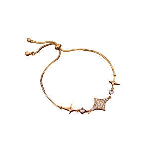 Adjustable gold star charm bracelet with sparkling cubic zirconia and pull-string slider