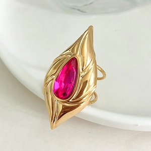 Gold stainless steel ring with a ruby teardrop zircon and engraved vintage texture