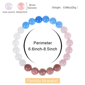 Natural 8mm rose quartz and rhodonite fertility beaded bracelet on white background