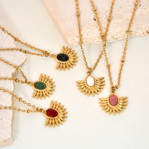 Detail of fan-shaped necklaces with inlaid natural stones and golden bead chain