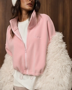 Close-up of pink fleece jacket with Flawless embroidery and stylish zipper detail