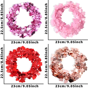 Four colors of heart-shaped glitter wreaths in pink and red for Valentine DIY decor