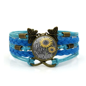 Blue braided You Are My Sunshine sunflower bracelet with bronze infinity and butterfly charms