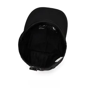 Internal view of black baseball cap showing breathable mesh lining and adjustable drawstring
