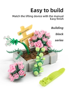 Close-up of DIY building block flower set featuring pink roses and a green brick separator