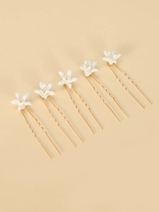 Detailed view of 6-piece bridal U-shaped hair pins with white flowers and crystals