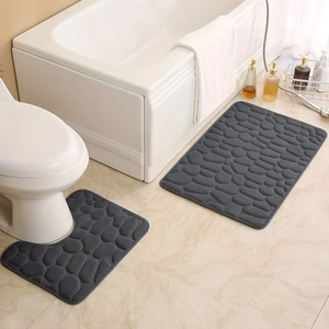 Detail of dark gray memory foam bathroom mat set with embossed pebble texture