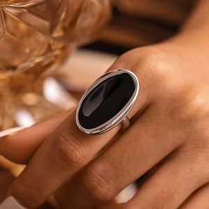 Oval black stone ring in silver stainless steel, luxury minimalist style for women