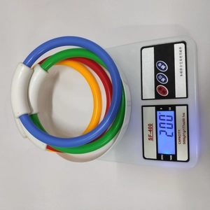 Detailed view of four colorful diving rings on a scale weighing approximately 200g