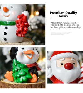 Detailed view of hand-painted resin Christmas figurines including Santa and snowman