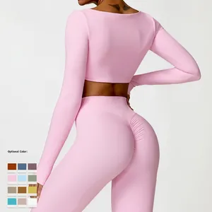 Pink long sleeve yoga crop top and high waist leggings set with scrunch butt detail