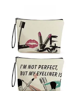 Detailed pattern display of canvas makeup bags with zippers and black wrist straps