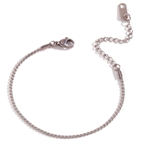 Detailed close-up of a silver stainless steel chain bracelet with lobster clasp and extender