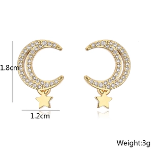 Detail view of 18K gold moon and star earrings with cubic zirconia and size dimensions