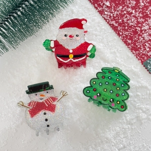 Three-piece Christmas hair claw clips set featuring Santa Claus, snowman, and tree designs