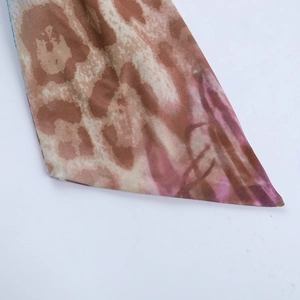Detail of the leopard print fabric with artistic purple and brown dye gradients