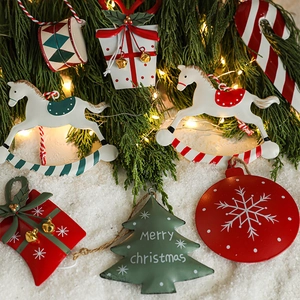 Hand-painted Christmas tin metal tree ornaments with festive drum and gift box designs