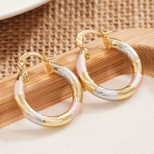 Three-tone textured hinged hoop earrings with gold, silver and rose gold wave design