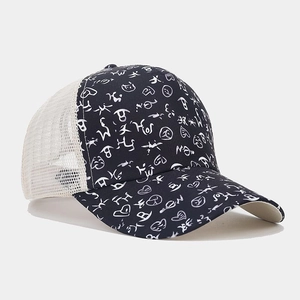 Close-up of mesh trucker hat featuring breathable netting and abstract graffiti print