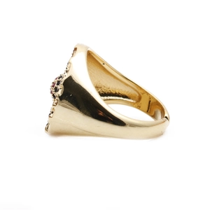Golden ring with red and black crystals, side view of Turkish evil eye jewelry piece