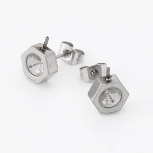 Minimalist silver hexagon nut stud earrings in polished stainless steel on white background