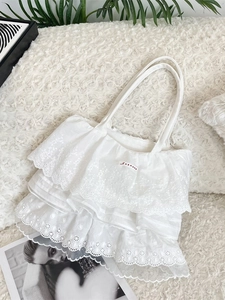 Borsa tote in pizzo bianco a balze con ricami floreali e design a balze multistrato