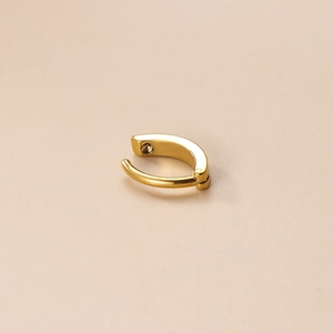 Minimalist golden stainless steel belly button ring with a smooth polished finish