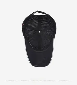 Detail view of the breathable mesh interior and top stitching of the black sports cap