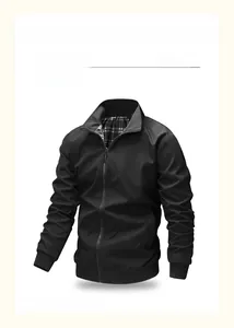 Detail of men's black bomber jacket featuring classic black and white checkered lining