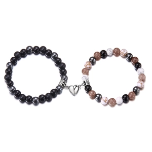 Natural stone bead bracelets for couples with magnetic heart clasp on white background