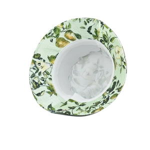 Detail of floral bucket hat showing light green pear print and white inner lining fabric