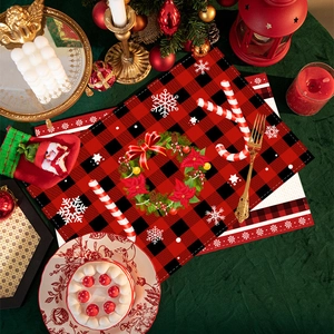 Christmas buffalo plaid placemats with reindeer and floral wreath holiday table decor