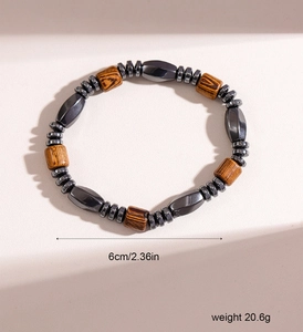 Detail view of hematite and wood bead bracelet showing 6cm diameter and 20.6g weight