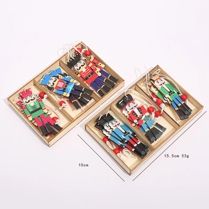 Close-up of wooden nutcracker soldier ornaments in a storage box with size measurements