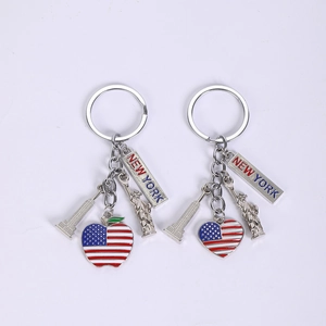 Detail of silver New York keychain with US flag heart and Statue of Liberty charms