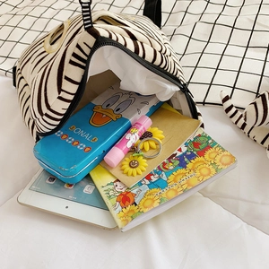 Cute black and white animal print plush backpack with spacious interior for kids