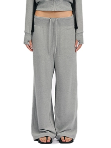 Detail of light grey lounge set with thumbhole cuffs, drawstring waist and knit texture