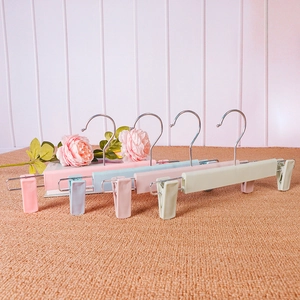 Adjustable non-slip matte plastic pants hangers in pastel colors for organized closets