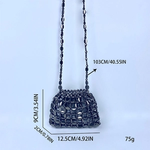 Detail of handmade black sequin mini bag with metallic disc mesh and beaded chain strap