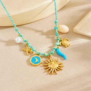 Detailed close-up of woven blue cord necklace with gold celestial and marine charms