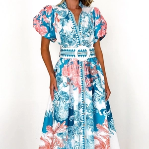 Bohemian floral maxi dress with puff sleeves and V-neckline in blue and coral print