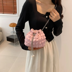 Chic pink pleated bucket bag with silver chain strap and pearl drawstring closure